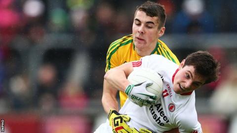 Donegal's Michael Carroll battles with Tyrone's David Mulgrew in the Ulster Minor game