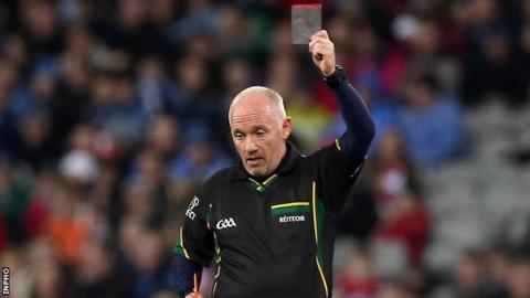 Sligo referee Marty Duffy waves a black card during this year's Football League