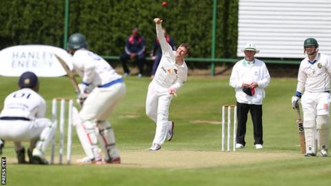Andrew White in bowling action during the Downpatrick game