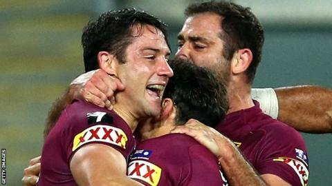 Cooper Cronk and team-mate celebrate