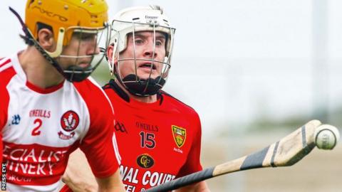 Michael Warnock of Derry and Down's James Coyle