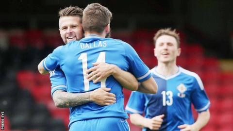 Oliver Norwood congratulates goal-scorer Stuart Dallas