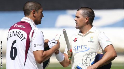 Glamorgan's Jacques Rudolph (right) with Rory Kleinveldt of Northants