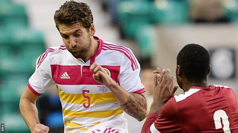 Charlie Mulgrew in action against Qatar