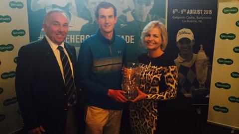 Tiarnan McLarnon receives the North of Ireland Strokeplay trophy from Valerie Penney, with Galgfrom Castle's captain Keith Dinsmore also in the picture