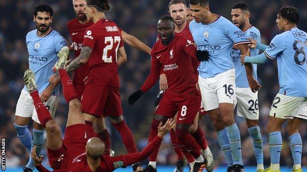 Manchester City and Liverpool players clash
