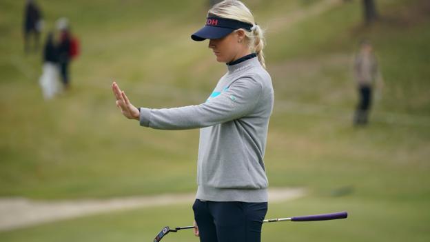 Charley Hull of England goes through her pre-putt routine on the 13th green during the final round of the TOTO Japan Classic
