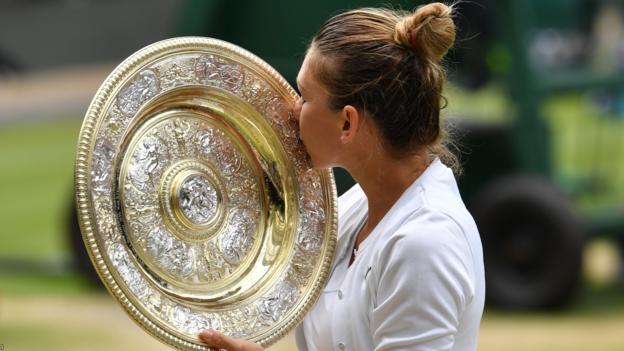 Romania's Simona Halep kisses the Venus Rosewater Dish trophy after beating US player Serena Williams during their women's singles final on day twelve of the 2019 Wimbledon Championships at The All England Lawn Tennis Club in Wimbledon, southwest London, on July 13, 2019. (Photo by GLYN KIRK / AFP) / RESTRICTED TO EDITORIAL USE (Photo credit should read GLYN KIRK/AFP/Getty Images)