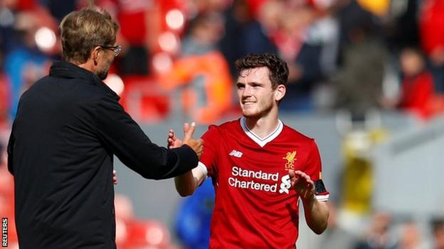 Liverpool defender Andrew Robertson is congratulated by his manager Jurgen Klopp