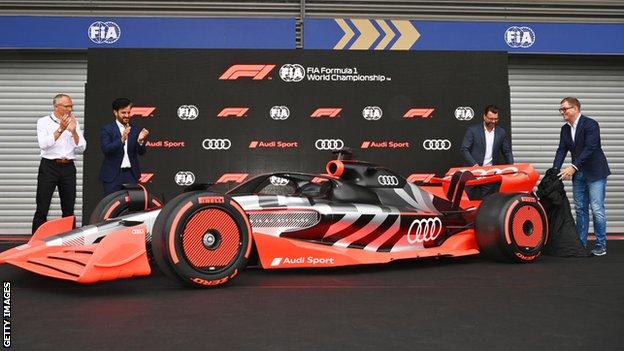 Stefano Domenicali, CEO of the Formula One Group, Mohammed ben Sulayem, FIA President, Markus Duesmann Audi CEO and Oliver Hoffmann of Audi reveal a concept vehicle