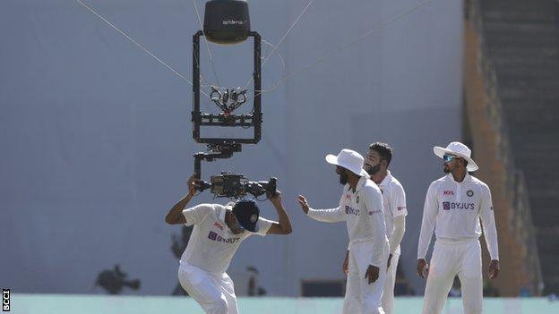 India players around spider cam in the second Test against New Zealand in Mumbai