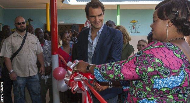 Roger Federer and Malawi's Minister of Gender, Children, Disability and Social Welfare Patricia Kaliati cut a ribbon at the official launch of Lundu Community Childcare Centre in Malawi's capital city district of Lilongwe