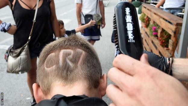 One fan even went as far as to shave a tribute to Ronaldo into his hair for his arrival
