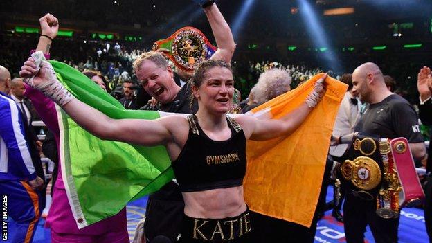 Katie Taylor celebrates with an Irish flag