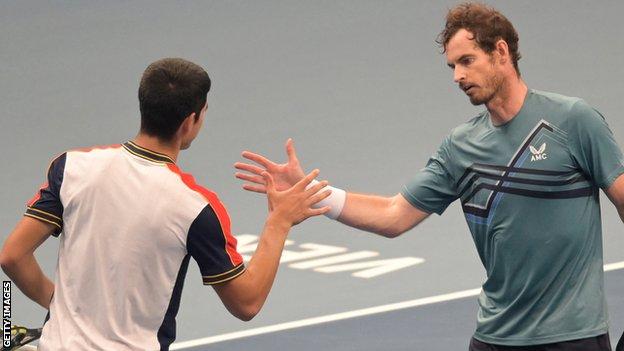 Andy Murray and Carlos Alcaraz shake hands after their match in Vienna