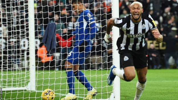 Joelinton runs away in celebration after scoring Newcastle's third goal in their Premier League win over Chelsea at St James' Park