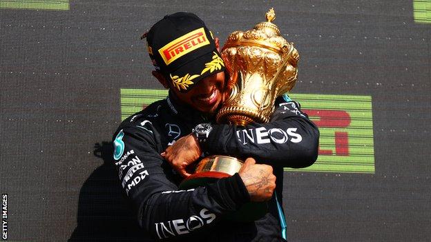 Lewis Hamilton with the British Grand Prix trophy
