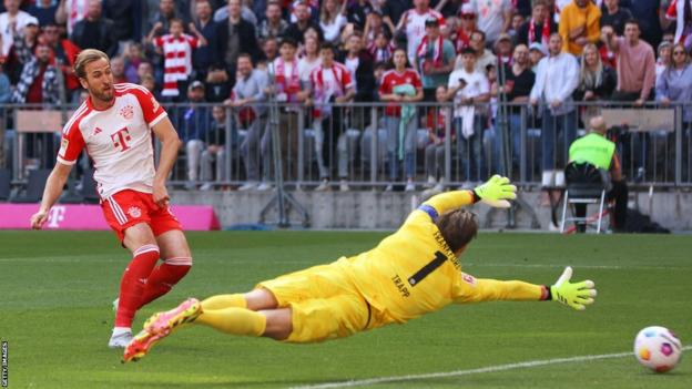 Bayern Munich's Harry Kane scores against Eintracht Frankfurt in Bundesliga