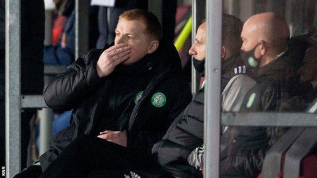 Celtic manager Neil Lennon looks concerned in the dugout