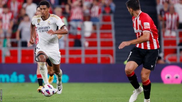 Jude Bellingham runs with the ball on his Real Madrid debut