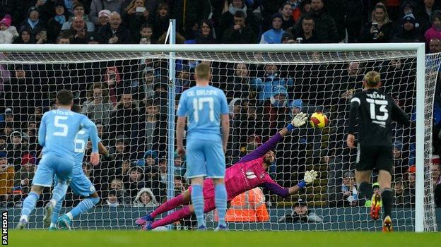 Riyad Mahrez scores from the penalty spot for Manchester City