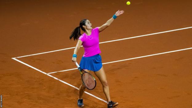 Emma Raducanu serves during her lucifer  against Jelena Ostapenko successful  Stuttgart