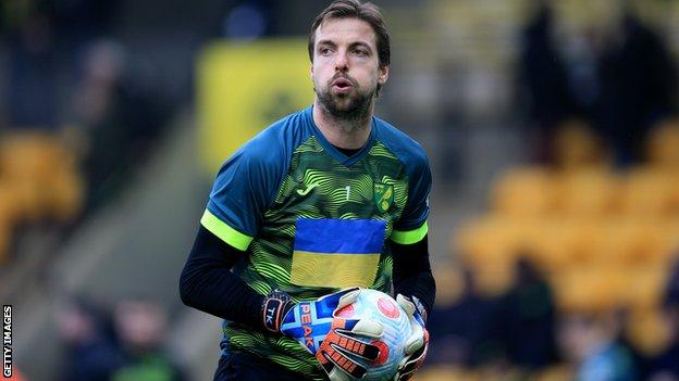 Norwich players including goalkeeper Tim Krul wore warm-up shirts emblazoned with the Ukrainian flag before their game with Brentford