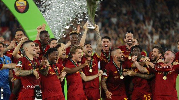 Roma's players celebrate winning the Europa Conference League final
