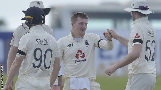 England's Dom Bess celebrates with Dom Sibley after taking a wicket against Sri Lanka