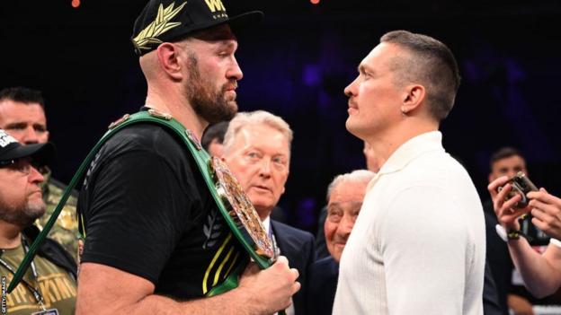 Tyson Fury and Oleksandr Usyk face off after the heavyweight fight between Tyson Fury and Francis Ngannou
