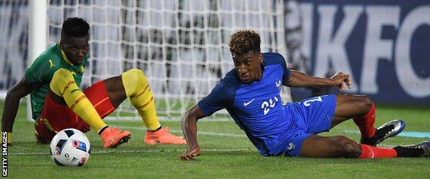 Cameroon's defender Adolphe Teikeu and France winger Kingsley Coman
