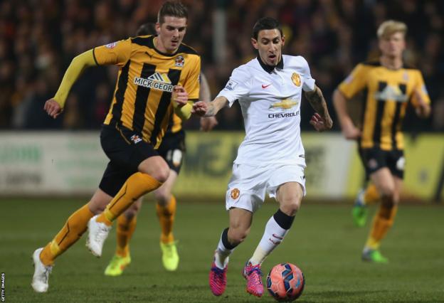 Liam Hughes in action against Angel di Maria during Cambridge United's FA Cup tie with Manchester United in 2015