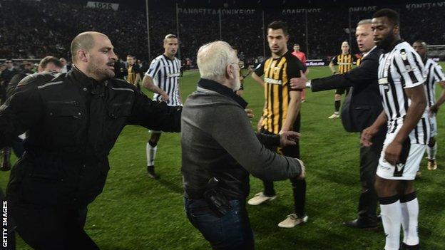 Ivan Savvidis storms the pitch with a gun in its holster
