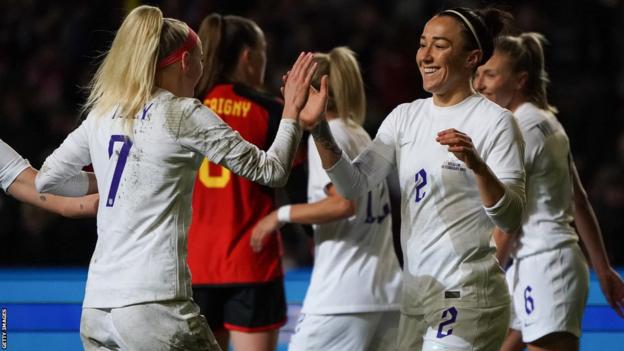 Lucy Bronze celebrates scoring against Belgium