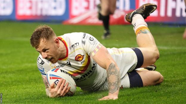 Tom Johnstone flops down to score a try for Catalans Dragons