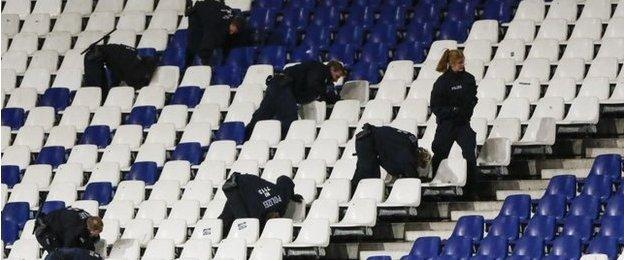 German police officers search between the seats