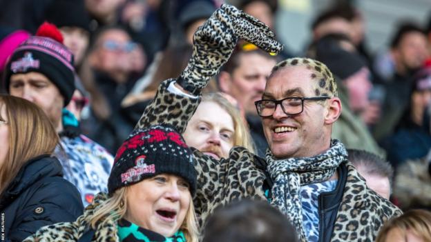 Leigh Leopards fans in costume at a game