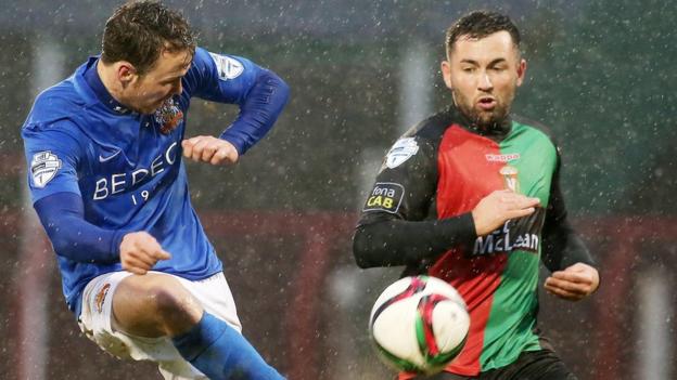Glenavon's Andy Hall in action against Niall Henderson of Glentoran