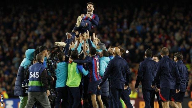 Barcelona players threw Gerard Pique into the air afterwards