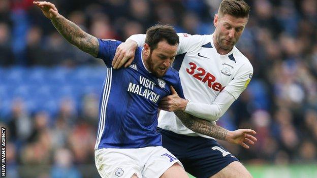 Lee Tomlin of Cardiff City is brought down by Preston North End's Paul Gallagher