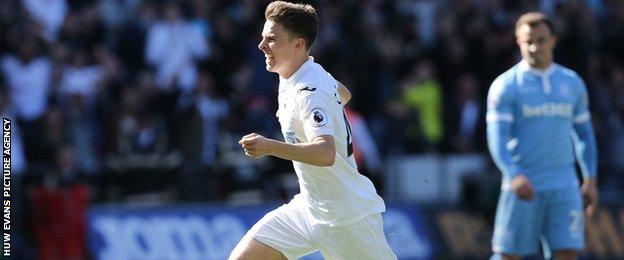 Tom Carroll celebrates Swansea's second goal against Stoke