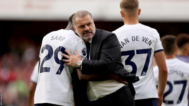 Ange Postecoglou congratulates his players after the draw at Arsenal