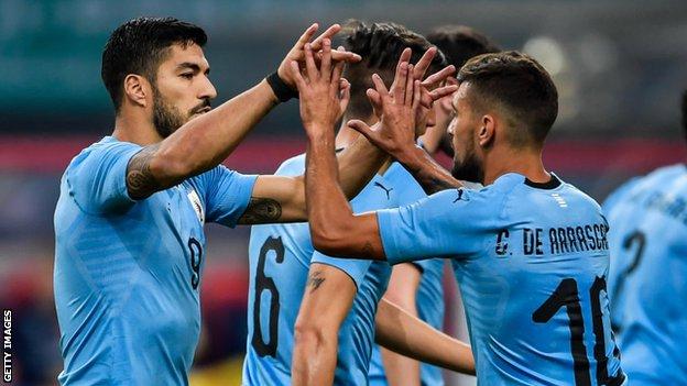 Luis Suarez celebrates with teammate Giorian De Arrascaeta