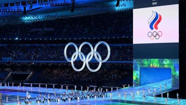 Team ROC carry flags during the Opening Ceremony of the Beijing 2022 Winter Olympics