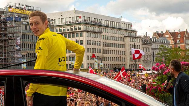 Jonas Vingegaard is saluted by flag-waving Danish fans