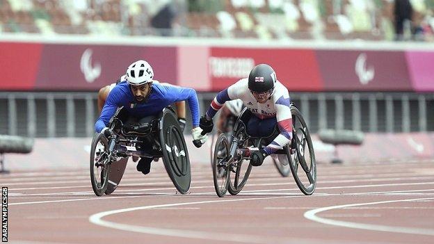 Ahmad Almutairi of Kuwait (left) and GB's Andrew Small (right) racing