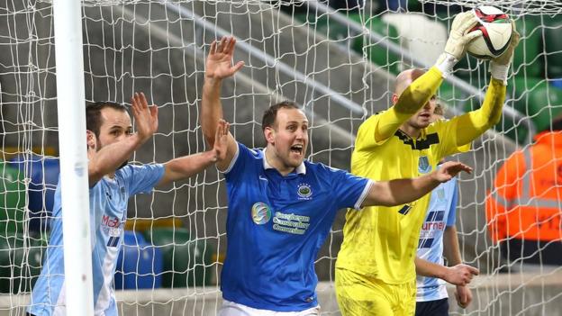 Has it crossed the line or not - Linfield striker Guy Bates claims it has but Alan Blayney is of a different opinion and the referee agrees with the United stopper