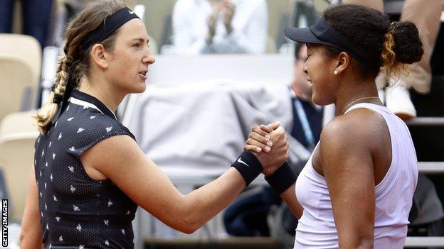 Victoria Azarenka shakes hands with Naomi Osaka after losing at the French Open in 2019