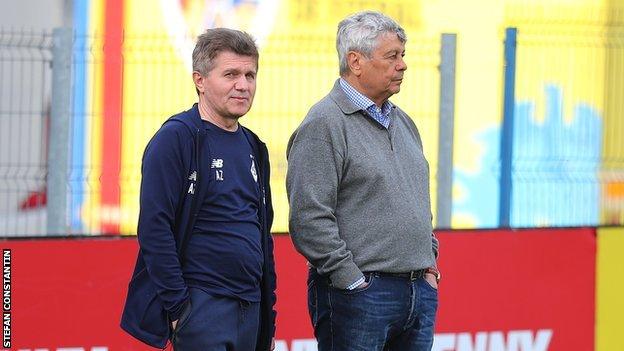 Dynamo Kyiv manager Mircea Lucescu, right, watches training