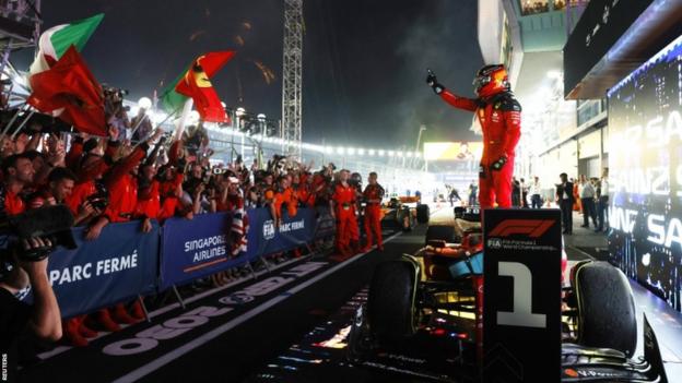 Carlos Sainz celebrates winning the Singapore Grand Prix